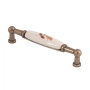 картинка Ручка меб. скоба мет. UP21 с керам. вставкой (крем) 96 старое золото/коричневый лист AKS тип 2 от магазина SEFI